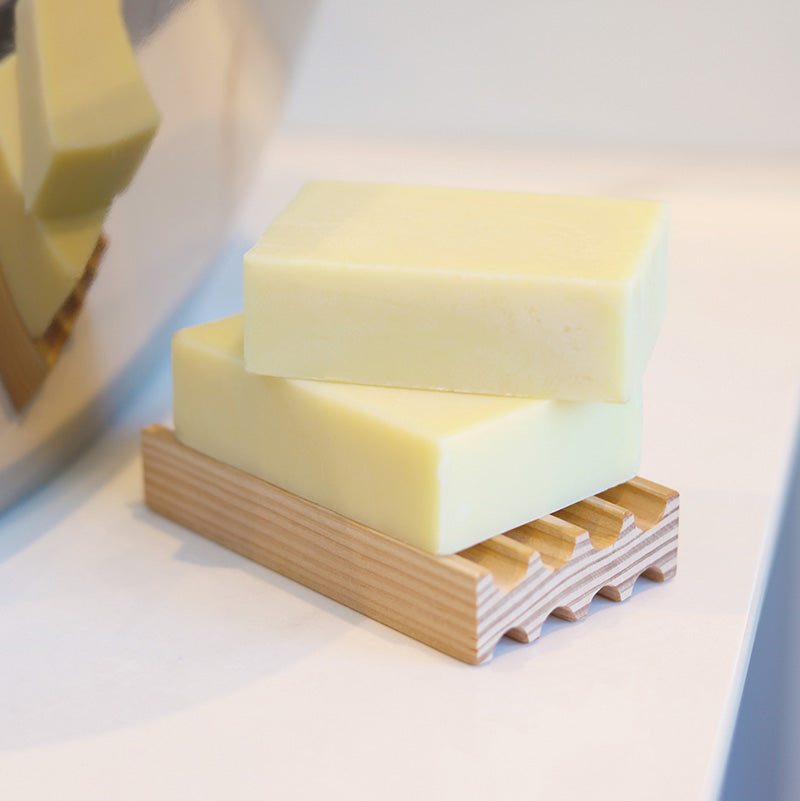Handmade soaps on top of the Douglas Fir Soap Rack by Coraline Skincare